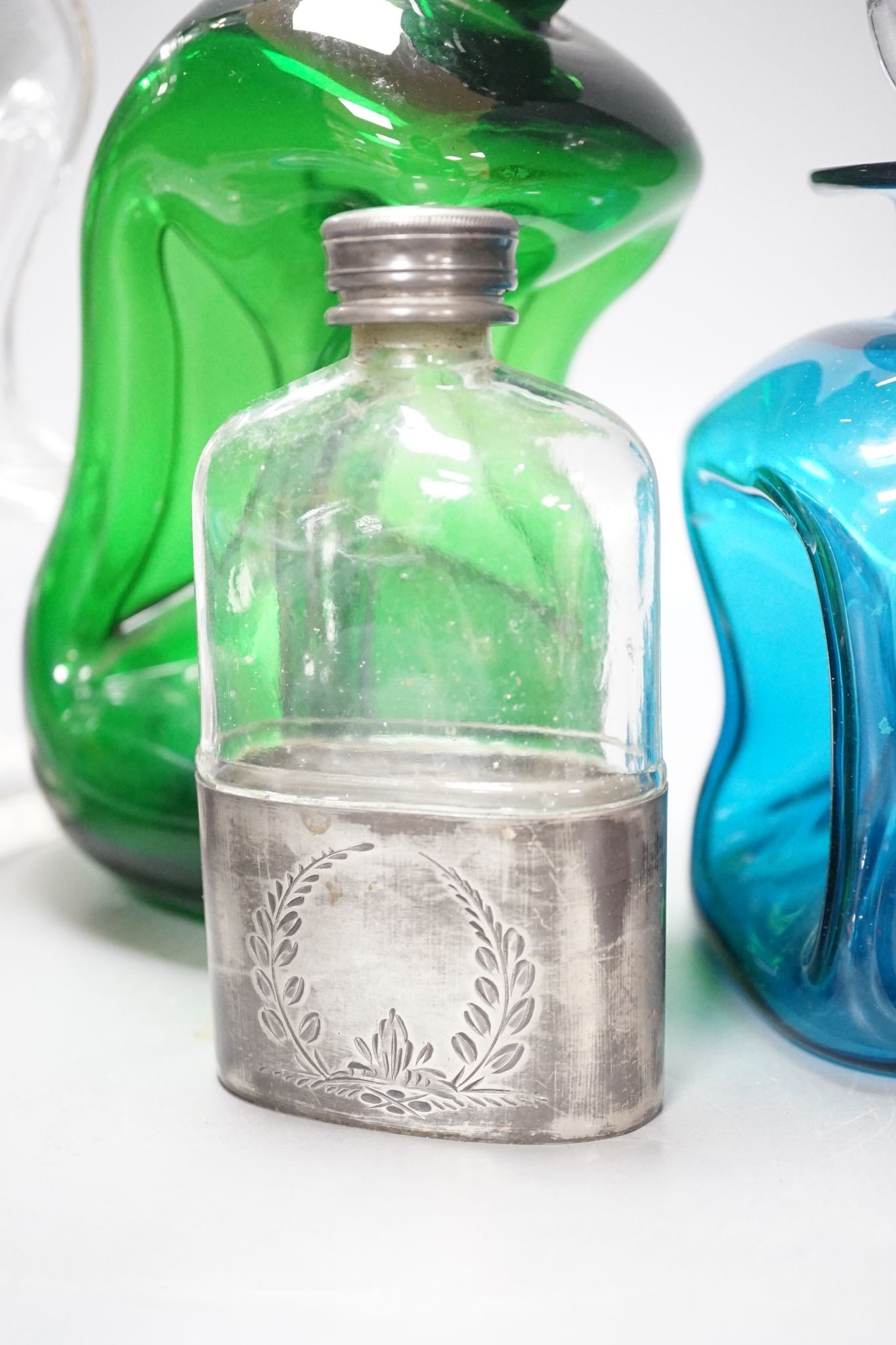Two green glass goblets, decanters, Murano glass fish, silver plate mounted hip flask etc.